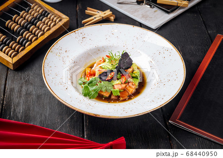 Tartare with red fish and greens in a sauce Tartare with red fish and greens in a sauce 68440950