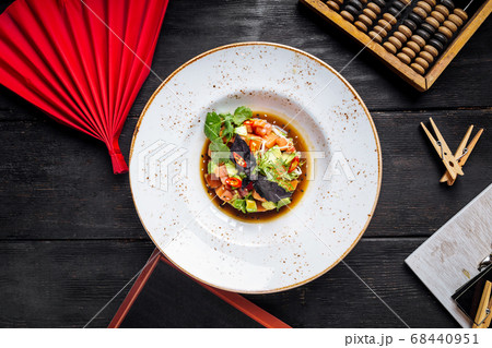 Tartare with red fish and greens in a sauce Tartare with red fish and greens in a sauce 68440951