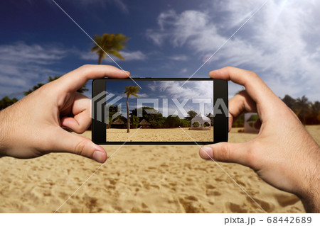 Photographing With Smartphone At Tropical Island Photographing With Smartphone At Tropical Island 68442689