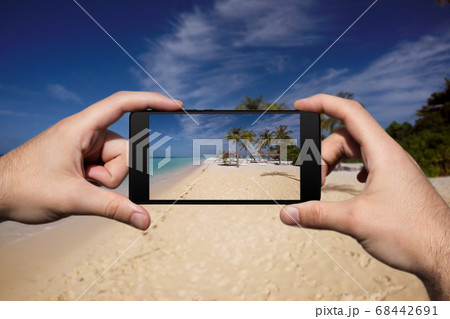 Photographing With Smartphone At Tropical Island Photographing With Smartphone At Tropical Island 68442691