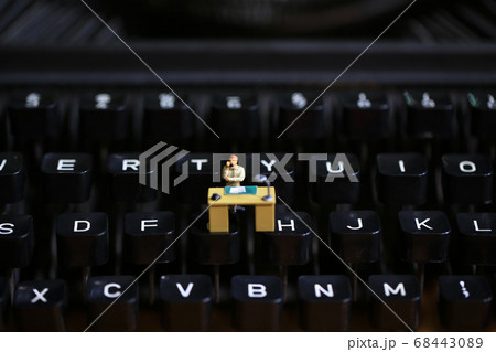typewriter with the figurines in work typewriter with the figurines in work 68443089
