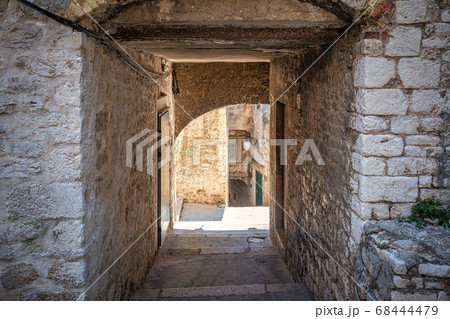 Street with a historic architecture in Sibenik. Street with a historic architecture in Sibenik. 68444479
