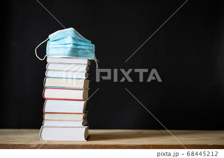 back to school during covid pandemic pile of books 68445212