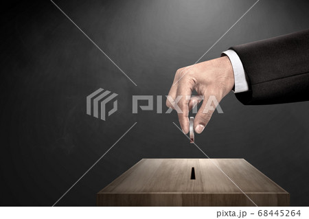 Businessman's hand giving donate charity to donation box Businessman's hand giving donate charity to donation box 68445264