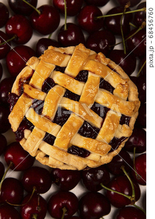 Cherry mini pie with ripe cherries on background of ripe cherries 68456760