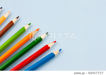 Pencils on a light blue background. Pencils on a light blue background. 68457727