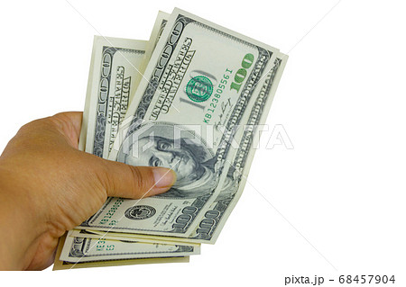 Female hand with one hundred dollars banknotes 68457904