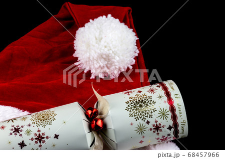Christmas Santa Hat and Cracker on Black Christmas Santa Hat and Cracker on Black 68457966