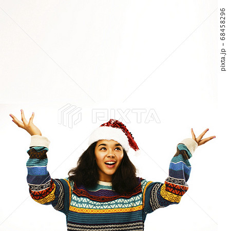 cute young real african real hipster girl in santas red hat isolated on white background waiting for winter Christmass 68458296