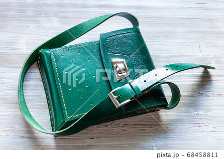 top view of handmade leather tablet bag on gray 68458811