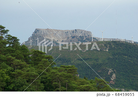 TARRAGONA, SPAIN - AUG 29th, 2017: A wind farm, group of Small wind turbine in the same location used to produce electricity in Catalonia TARRAGONA, SPAIN - AUG 29th, 2017: A wind farm, group of Small wind turbine in the same location used to produce electricity in Catalonia 68459055