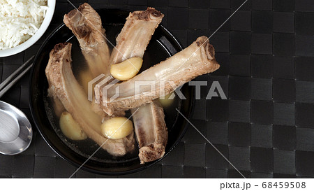 Bak kut teh or pork ribs soup which made from many ingredients such as big garlic, white pepper and many spices. Very popular traditional authentic menu dish in Singapore and Malaysia. Serve with rice 68459508