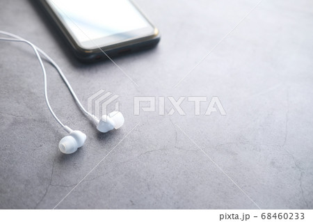 smart phone and earphone on black background, close up smart phone and earphone on black background, close up 68460233