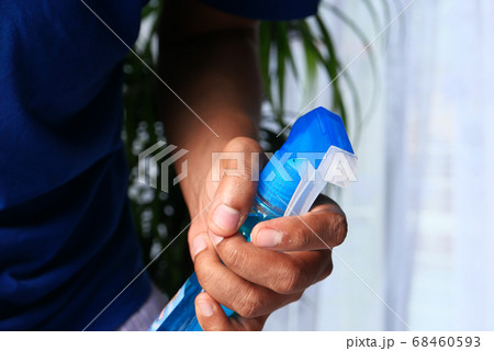 hand holding spray bottle cleaning and disinfection for coronavirus 68460593