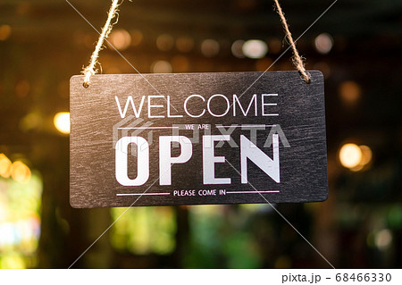 A business sign that says open on cafe or 68466330