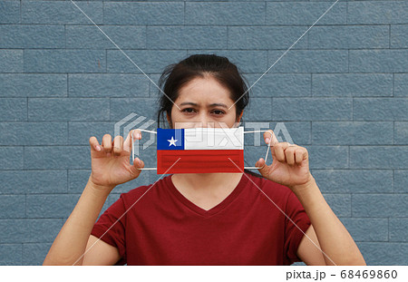 A woman and hygienic mask with Chile flag pattern A woman and hygienic mask with Chile flag pattern 68469860