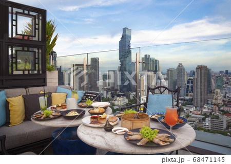Table of chinese food on the table in roof top bar Table of chinese food on the table in roof top bar 68471145