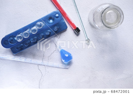 Top view of blood test tube and laboratory equipment on table  68472001