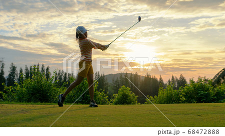 Golfer sport course golf ball fairway.  People lifestyle woman playing game golf tee of 68472888