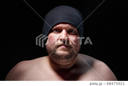Portrait of fat man in cap with nude shoulders Portrait of fat man in cap with nude shoulders 68473021