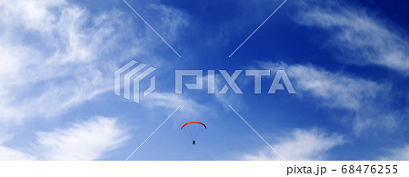 Silhouette of skydiver at sky Silhouette of skydiver at sky 68476255