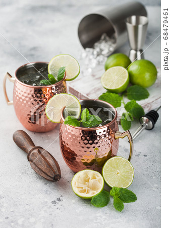 Moscow mule cocktail in a copper mug with lime  68479461
