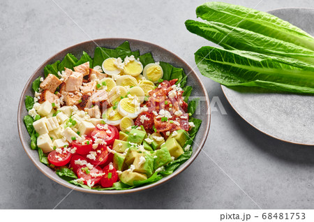Cobb Salad in gray matte bowl on concrete table Cobb Salad in gray matte bowl on concrete table 68481753