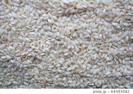 Pile of raw jasmine rice textured background Pile of raw jasmine rice textured background 68484082