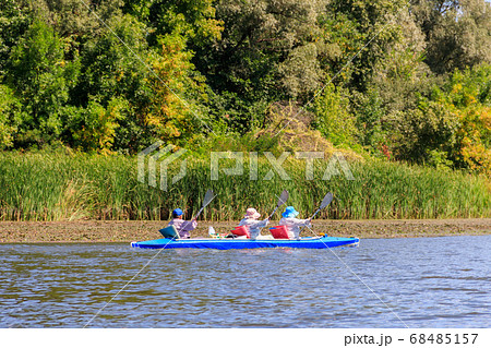 Kayaking on the beautiful river at summer Kayaking on the beautiful river at summer 68485157