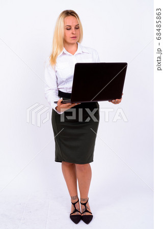 Portrait of young beautiful businesswoman with blond hair Portrait of young beautiful businesswoman with blond hair 68485863