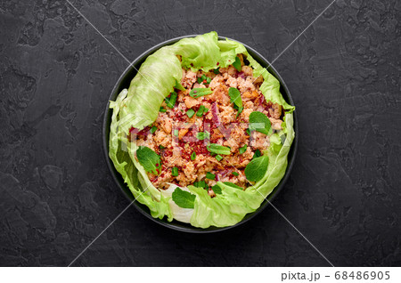 Laab Gai - Thai Minced Chicken Salad in black bowl Laab Gai - Thai Minced Chicken Salad in black bowl 68486905
