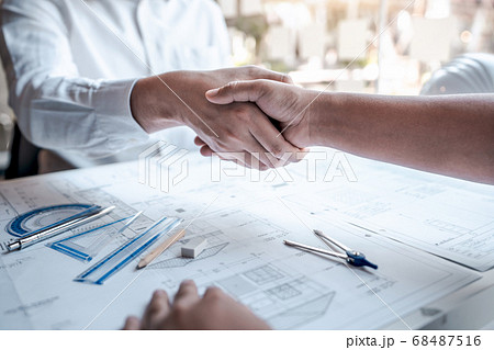 Team of architects or engineering shaking hands 68487516
