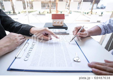 Real estate agent are presenting home loan and Real estate agent are presenting home loan and 68487638