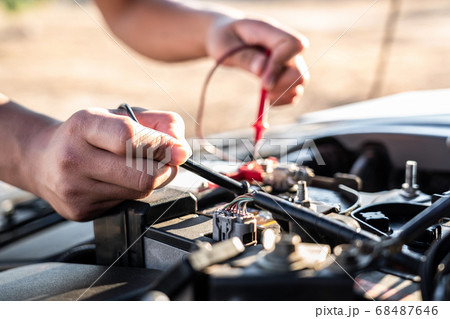 Mechanic repairman checking engine automotive in 68487646