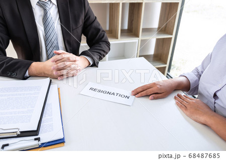 Employee sending resignation letter to boss 68487685