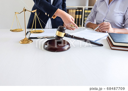 Professional female lawyer or counselor discussing Professional female lawyer or counselor discussing 68487709