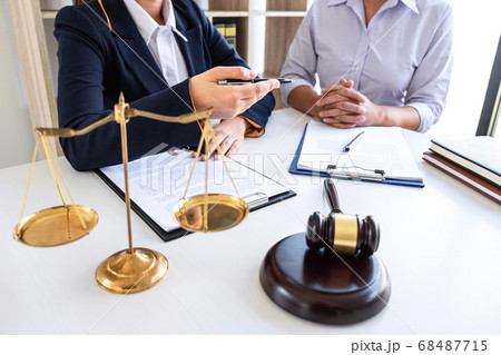 Professional female lawyer or counselor discussing Professional female lawyer or counselor discussing 68487715