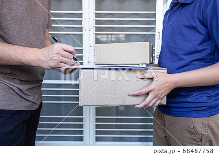 Young Delivery man deliver box parcel package and 68487758