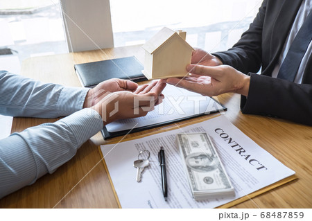 Real estate agent are presenting home loan and Real estate agent are presenting home loan and 68487859