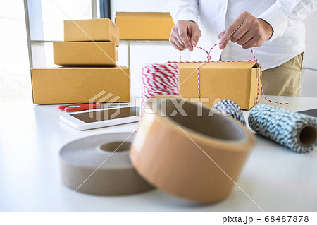 Young business owner work at home receive order Young business owner work at home receive order 68487878