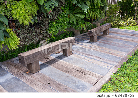 Wood bench made from log. 68488758