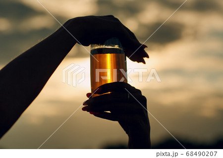 Woman farmer with sunflower oil at sunflowers field. Harvesting and farming concept. 68490207
