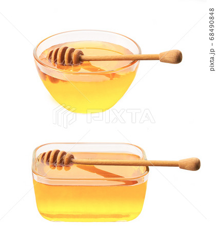 plate of natural honey isolated on white 68490848
