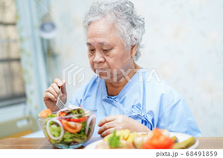 Asian senior or elderly old lady woman patient eating breakfast  68491859