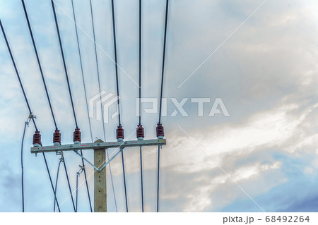 tensioned power lines attached to a pole against tensioned power lines attached to a pole against 68492264