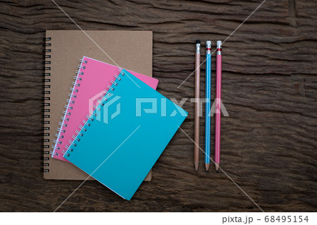 Pencil and book mockup on the old wood desk at the background, Flat lay photo, top view Pencil and book mockup on the old wood desk at the background, Flat lay photo, top view 68495154