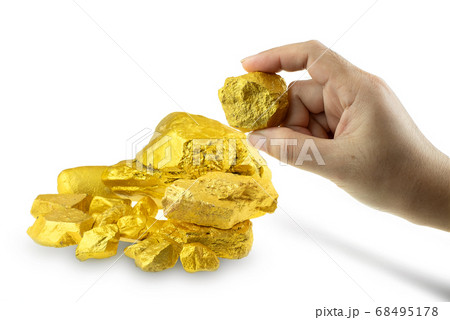 Woman hand holding gold nugget at the white background Woman hand holding gold nugget at the white background 68495178