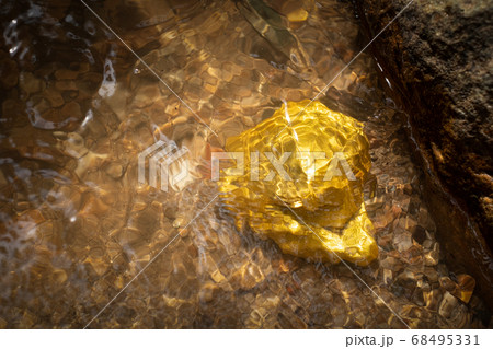 Pure gold nugget ore found in mine with natural underwater sources 68495331