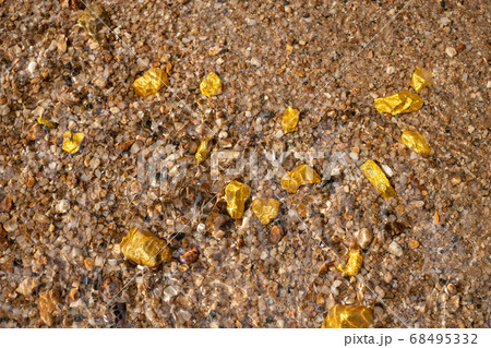 Pure gold nugget ore found in mine with natural underwater sources Pure gold nugget ore found in mine with natural underwater sources 68495332