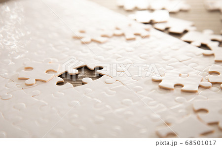 close up of white jigsaw puzzle 68501017